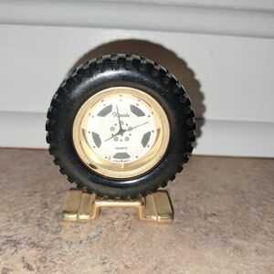 Vintage Xanadu small pocket watch on car tire stand, not working